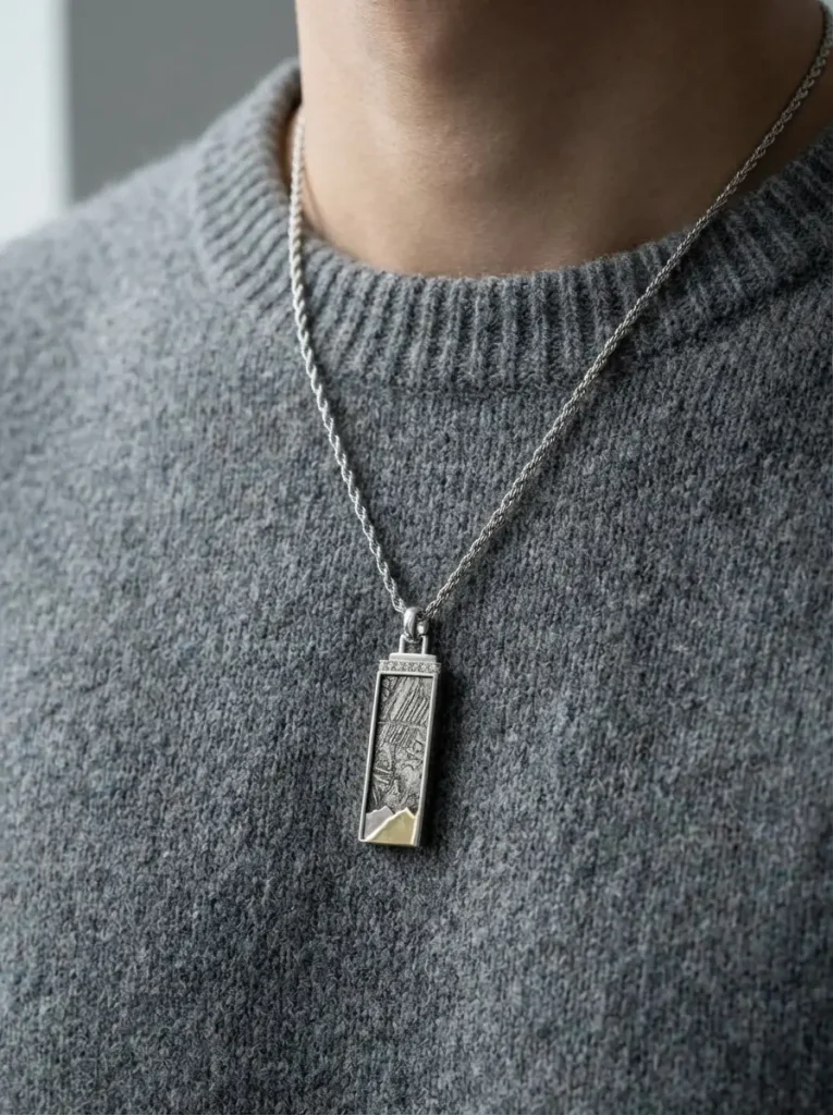 The Ridge Aletai meteorite bar pendant worn by model