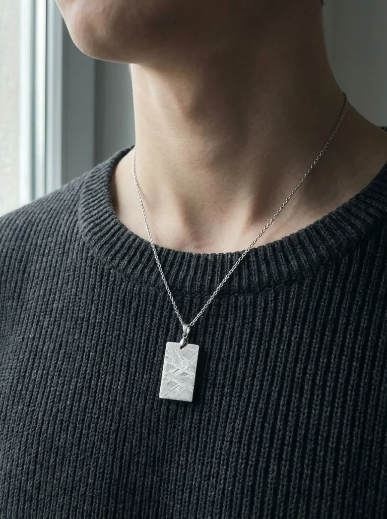 The Quiet Tag Aletai meteorite dog tag necklace worn by model